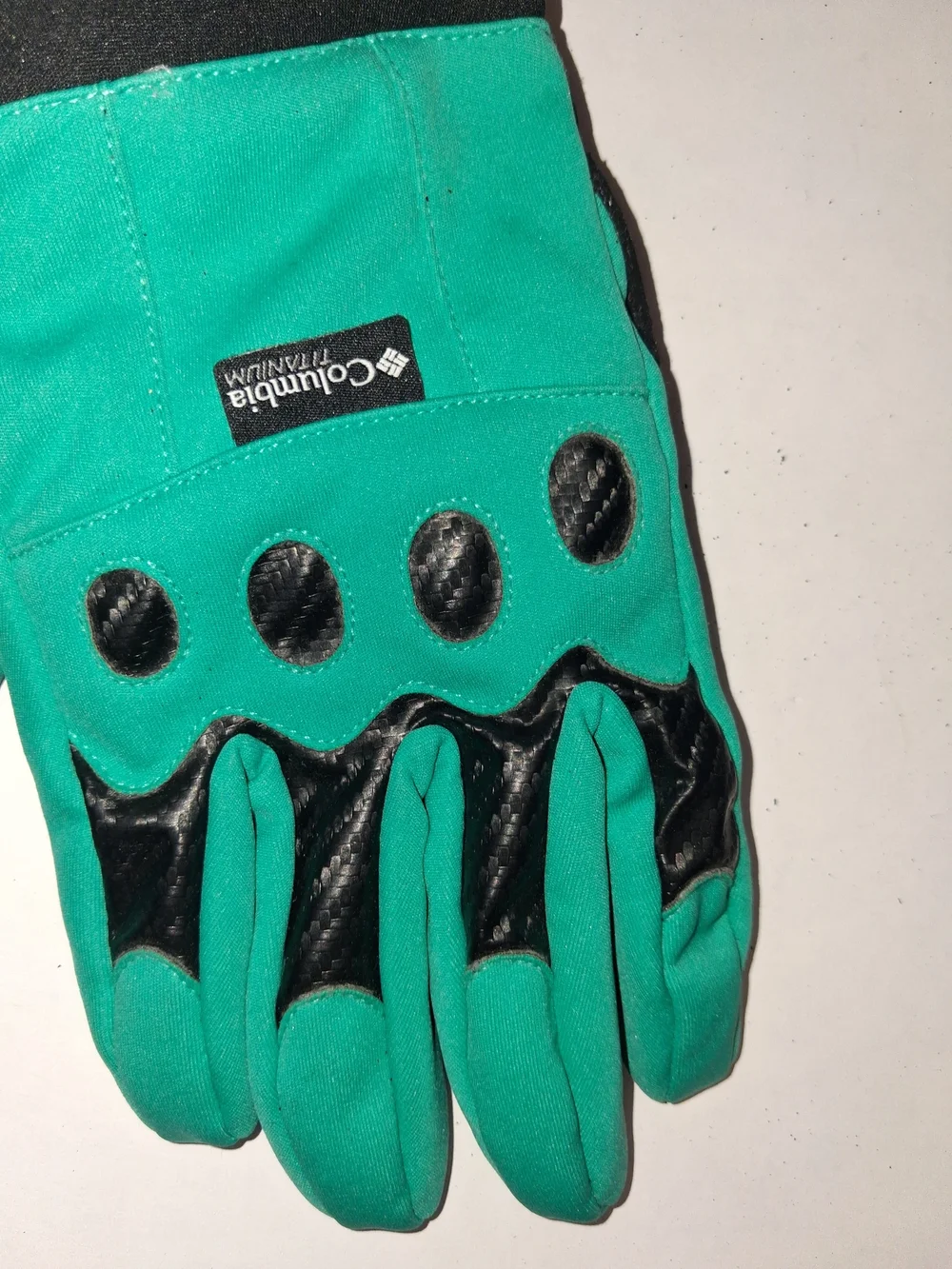 Columbia Omni-Shield teal and black outdoor gloves featuring textured grip palms